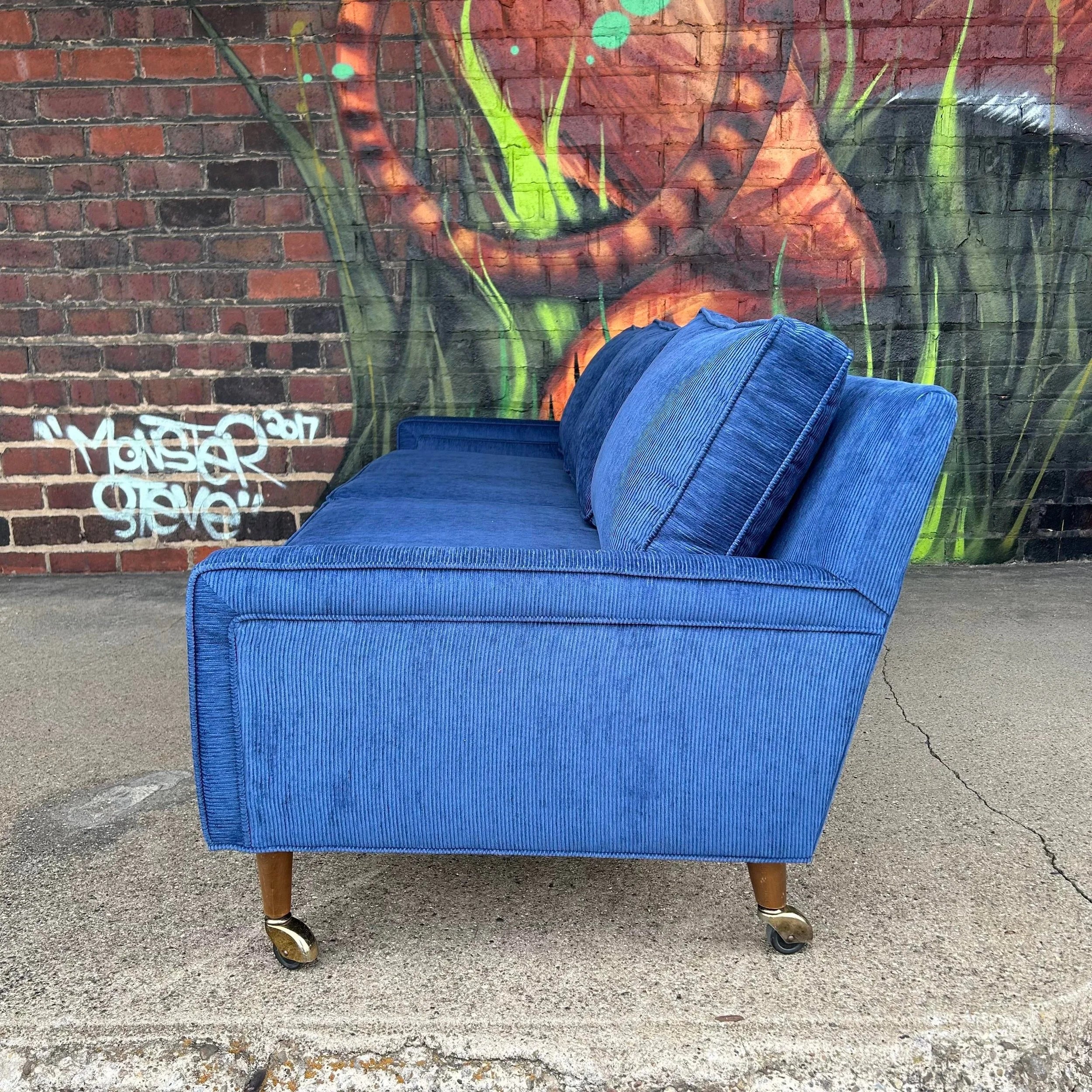 Reupholstered Blue Corduroy sofa on Casters Selig Style