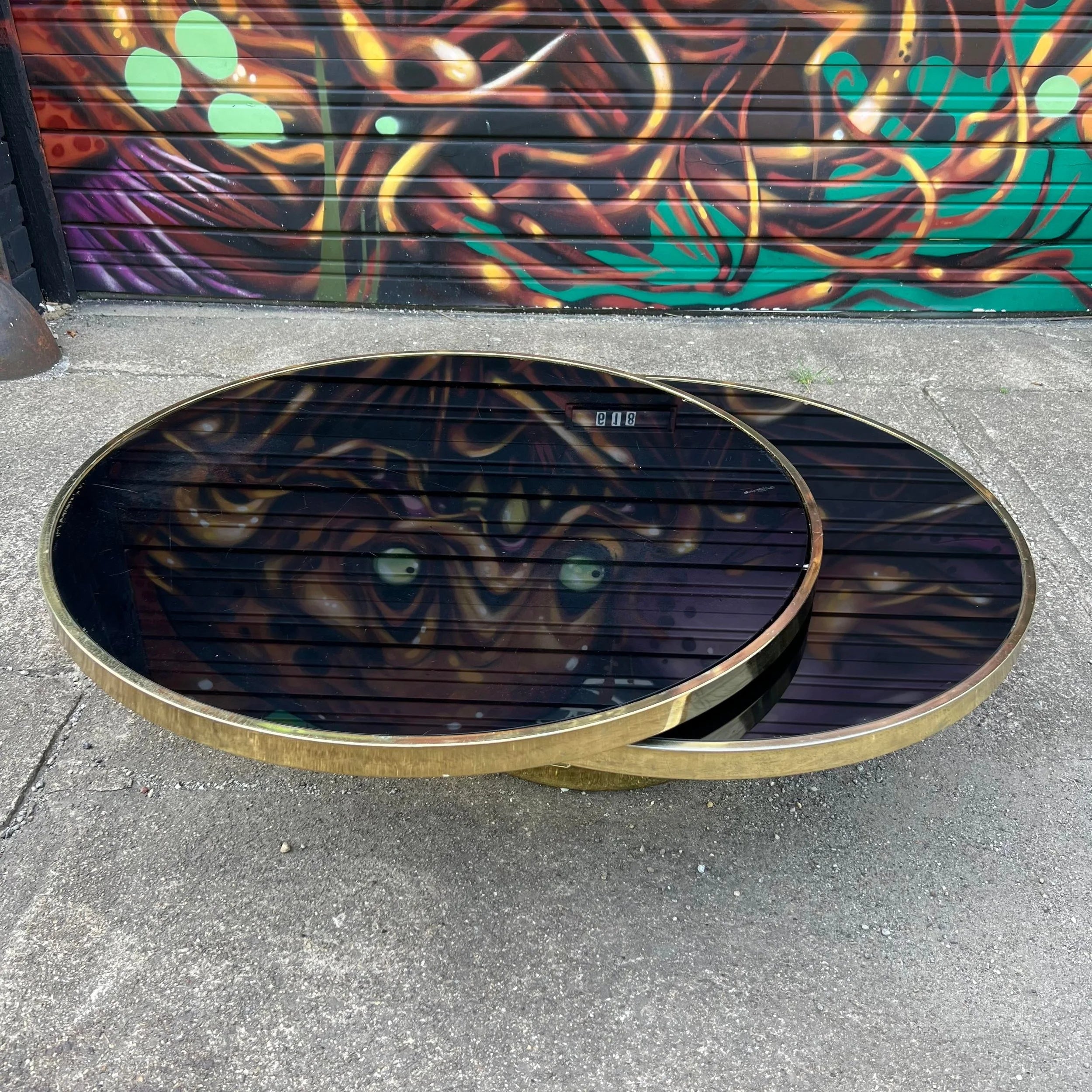 Milo Baughman Black Glass and Brass Two Tier Swivel Coffee Table