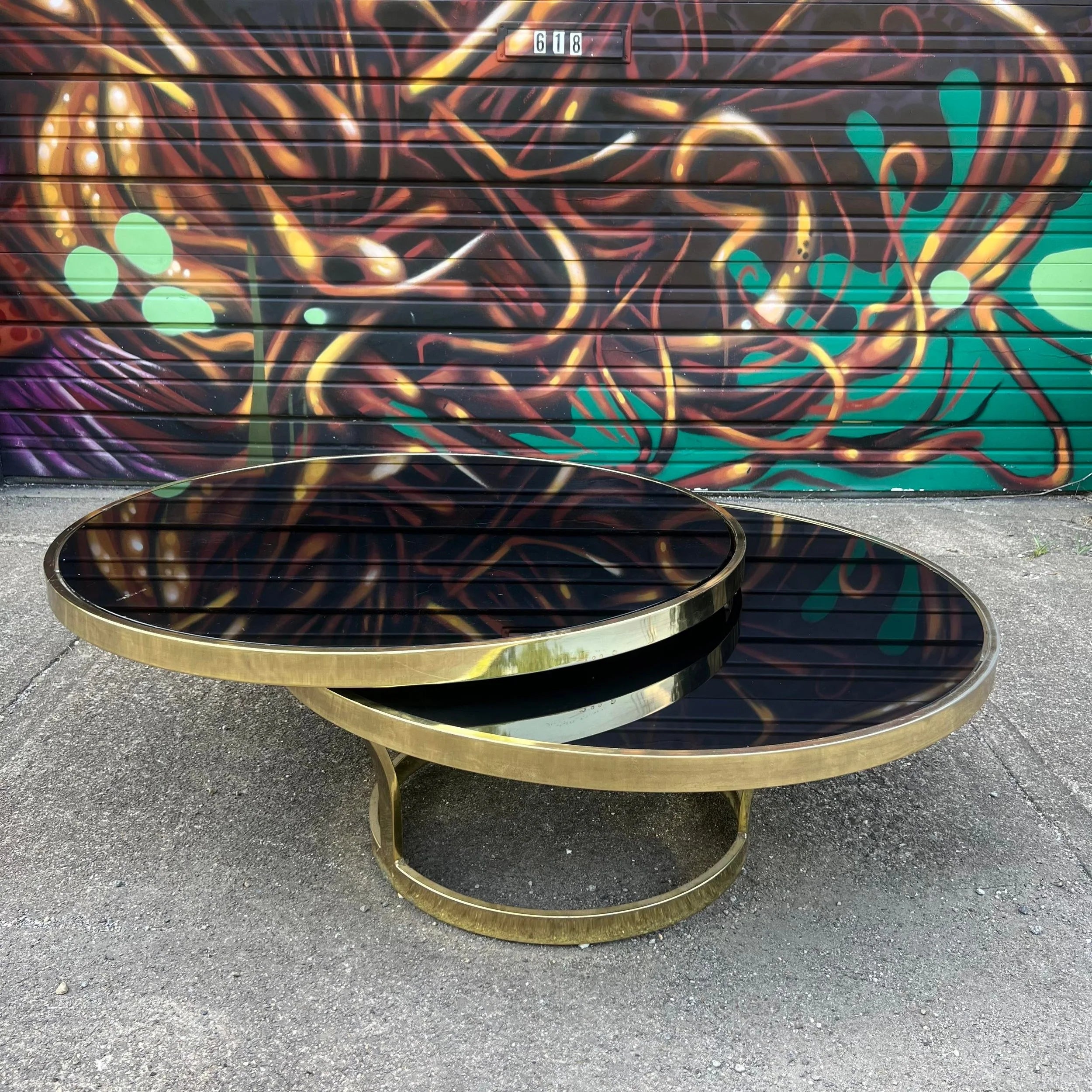Milo Baughman Black Glass and Brass Two Tier Swivel Coffee Table
